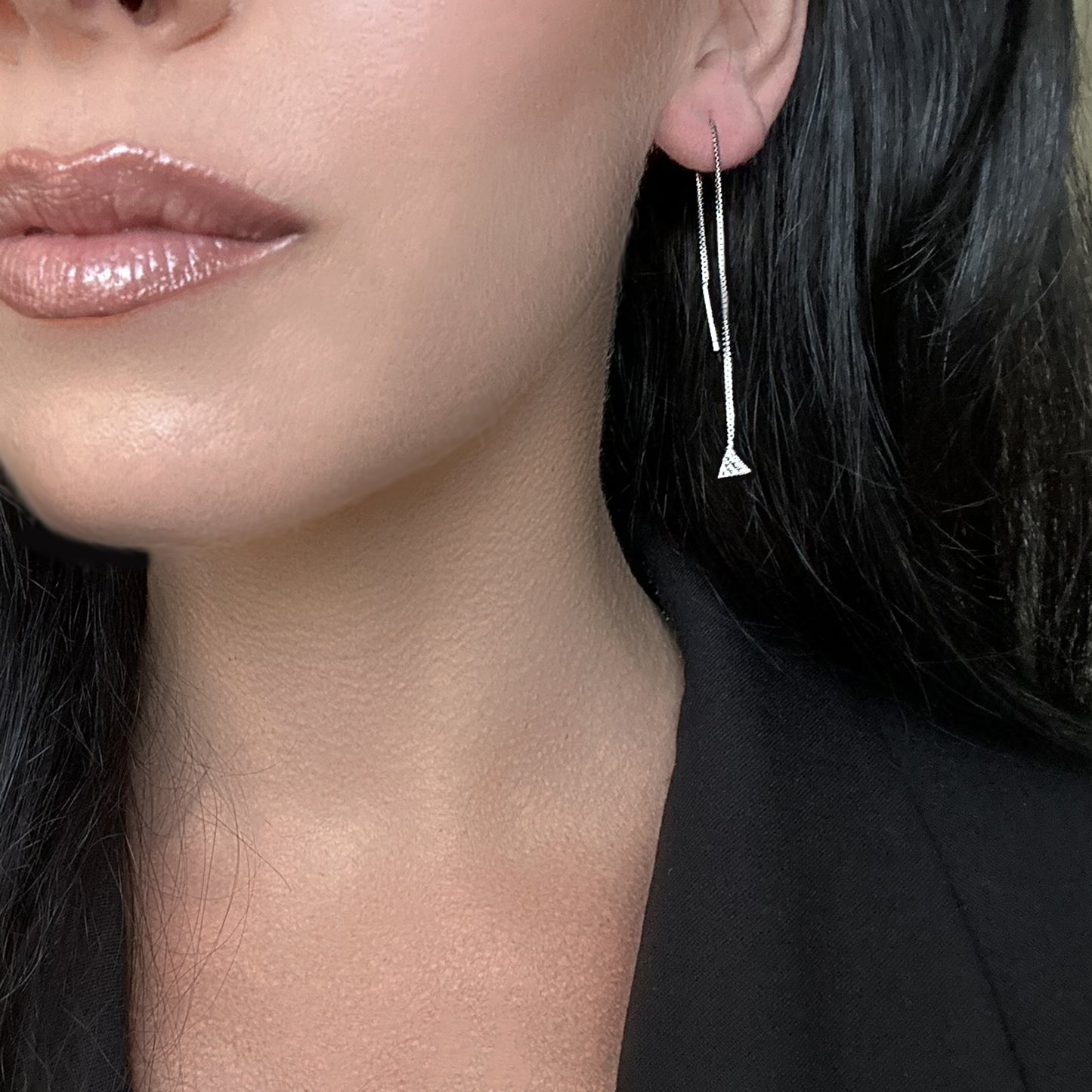 Add a touch of sparkle to your look with these elegant threader earrings, featuring a delicate triangle charm encrusted with pave stones. The adjustable length allows for versatile styling, making them perfect for stacking and layering with other favorites. Designed with comfort in mind, these lightweight earrings are ideal for sleeping or all-day wear. Handcrafted with high-quality 925 sterling silver.