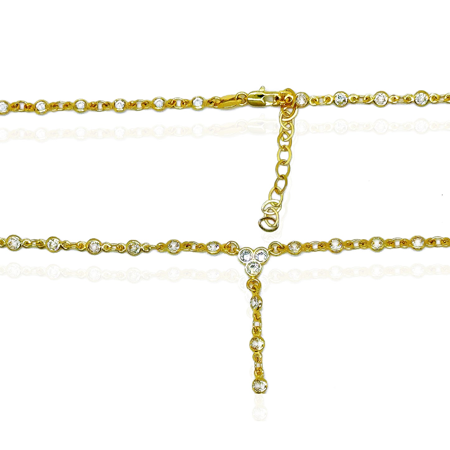 Close-up of an adjustable 18k gold-filled chain necklace with bezel-set cubic zirconia stones, showing the clasp and extender details for a perfect fit.