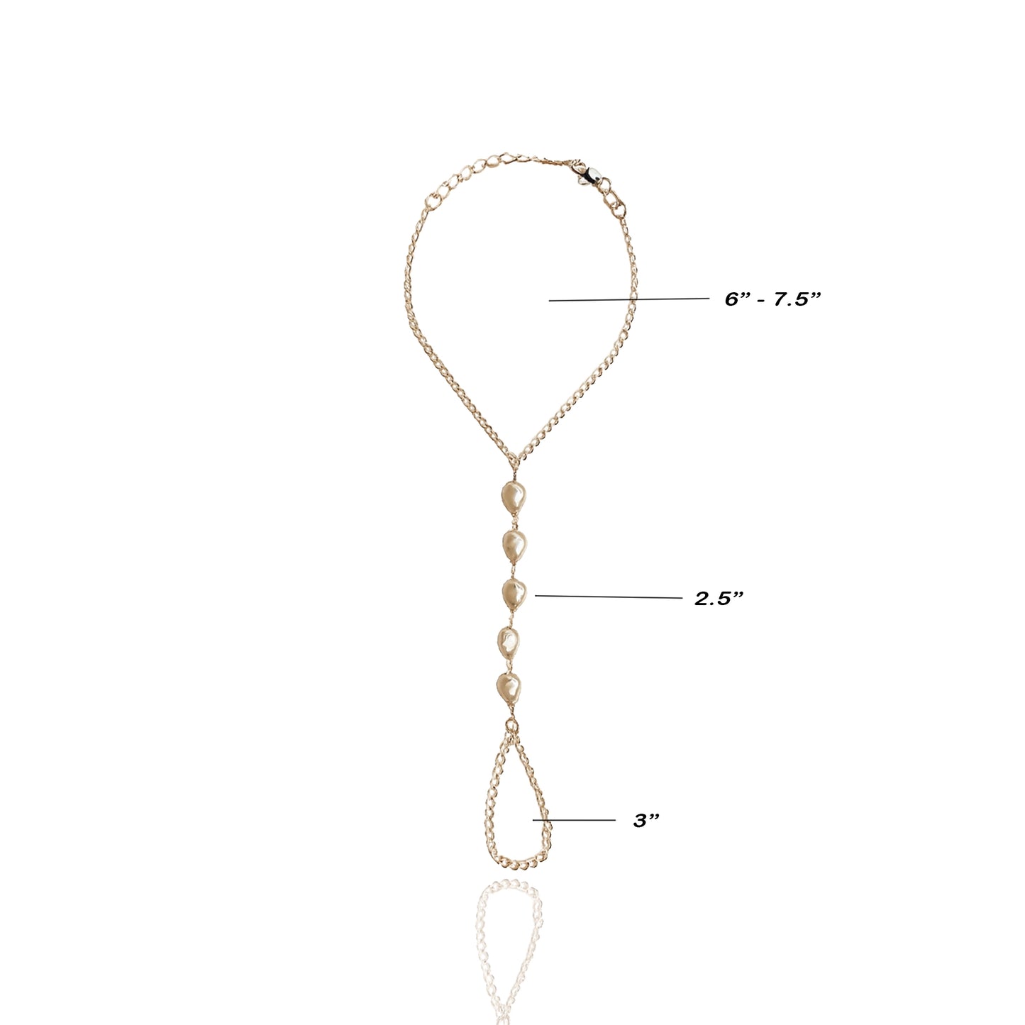 18K gold filled hand harness bracelet with imitation baroque pearls, shown flat with measurements: 6–7.5 inch wrist chain, 2.5 inch center drop with pearls, and 3 inch finger loop chain. Minimalist design with reflective shadows on white background.