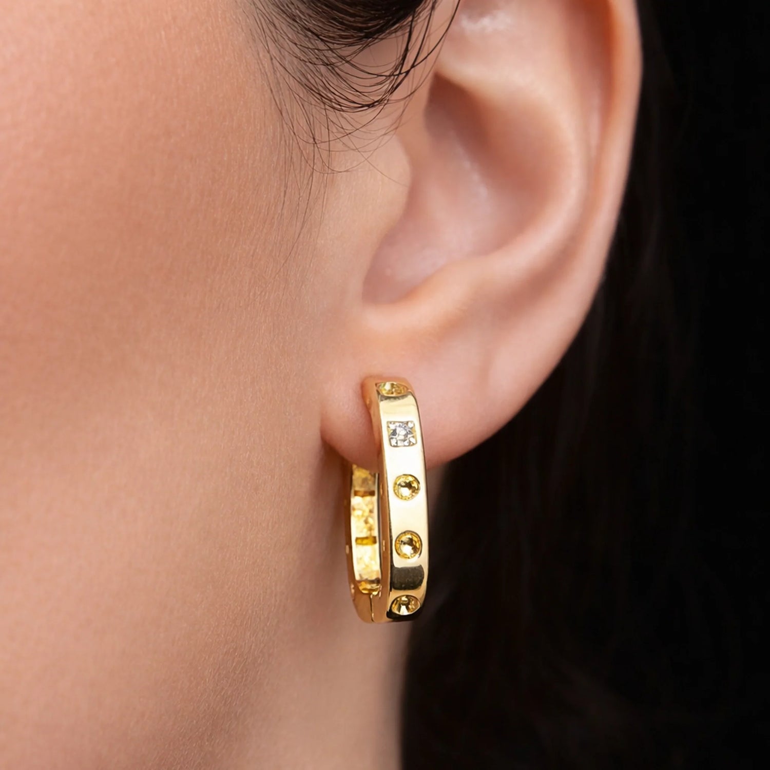 18K gold filled CZ hoop earrings on model, minimalist sparkling huggie earrings close-up photo