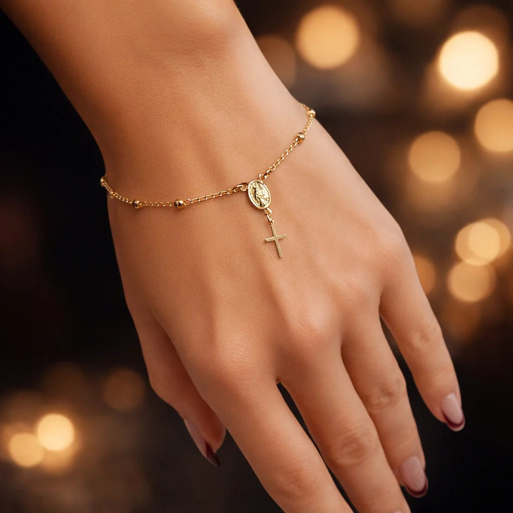 Gold filled Virgin Mary hand chain bracelet with cross charm on model, Christian slave bracelet jewelry close-up photo