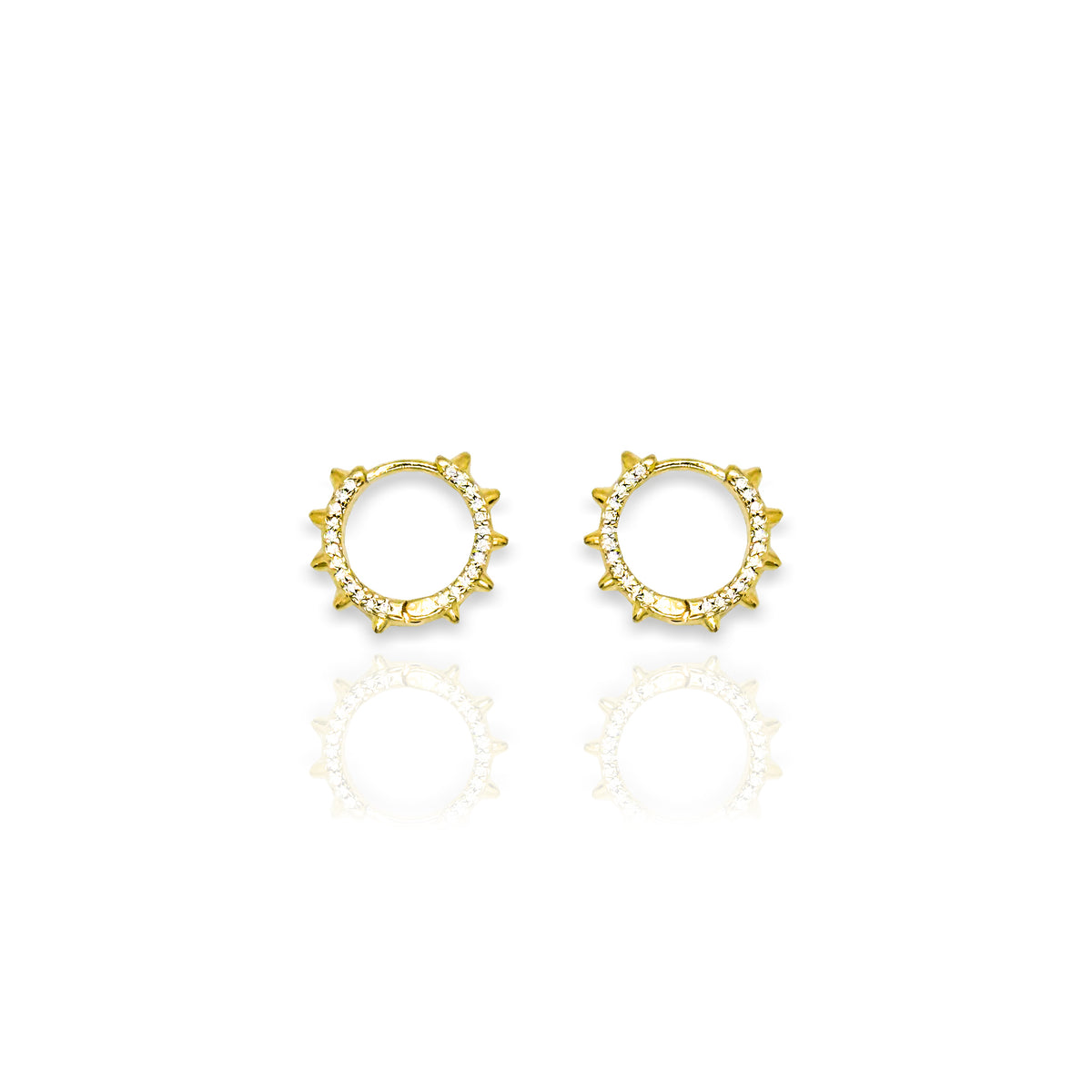 Pair of 18k gold filled circular stud earrings with spike edges and cubic zirconia accents, displayed on a clean white background with a soft reflection.