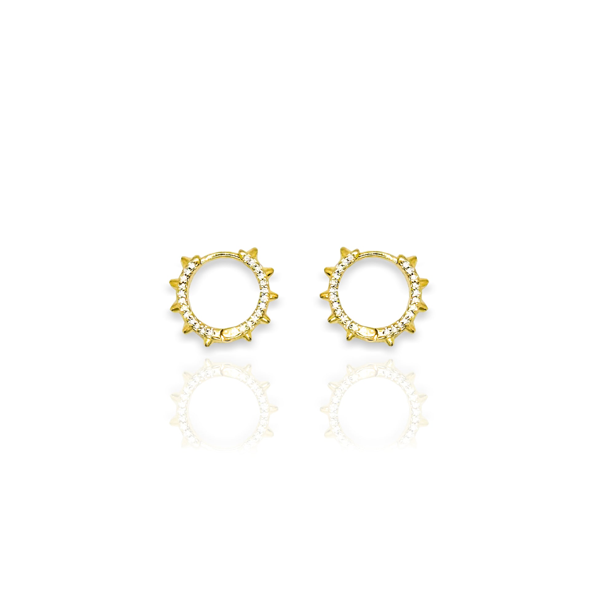 Pair of 18k gold filled circular stud earrings with spike edges and cubic zirconia accents, displayed on a clean white background with a soft reflection.