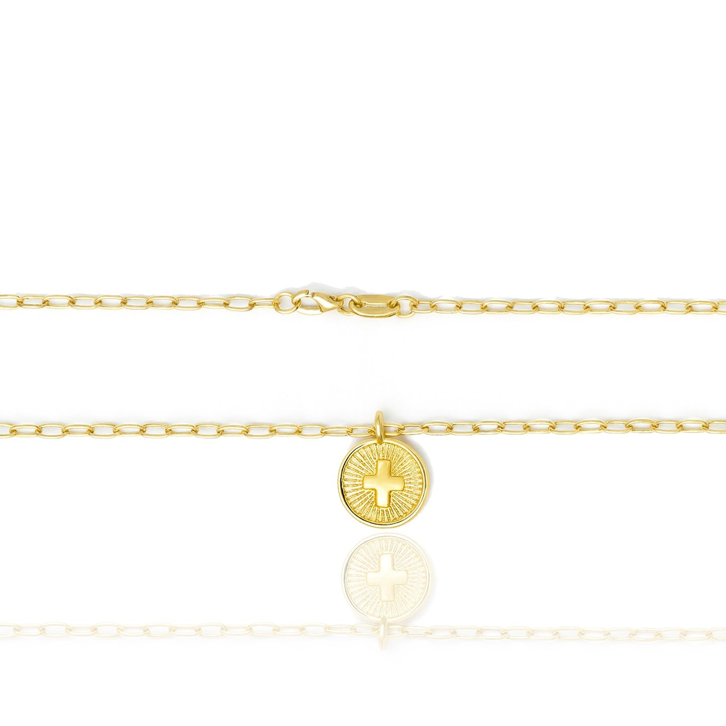 18k gold filled round cross medallion necklace with sunburst detailing on a flat paperclip chain, displayed with reflective surface for a clean product showcase.