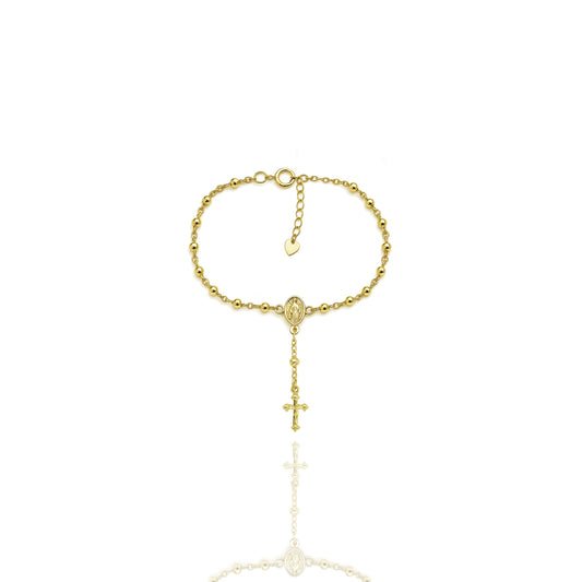 18k gold filled rosary bracelet with beaded chain, Virgin Mary center medal, and a delicate dangling cross charm, displayed on a white background with reflective shadow.