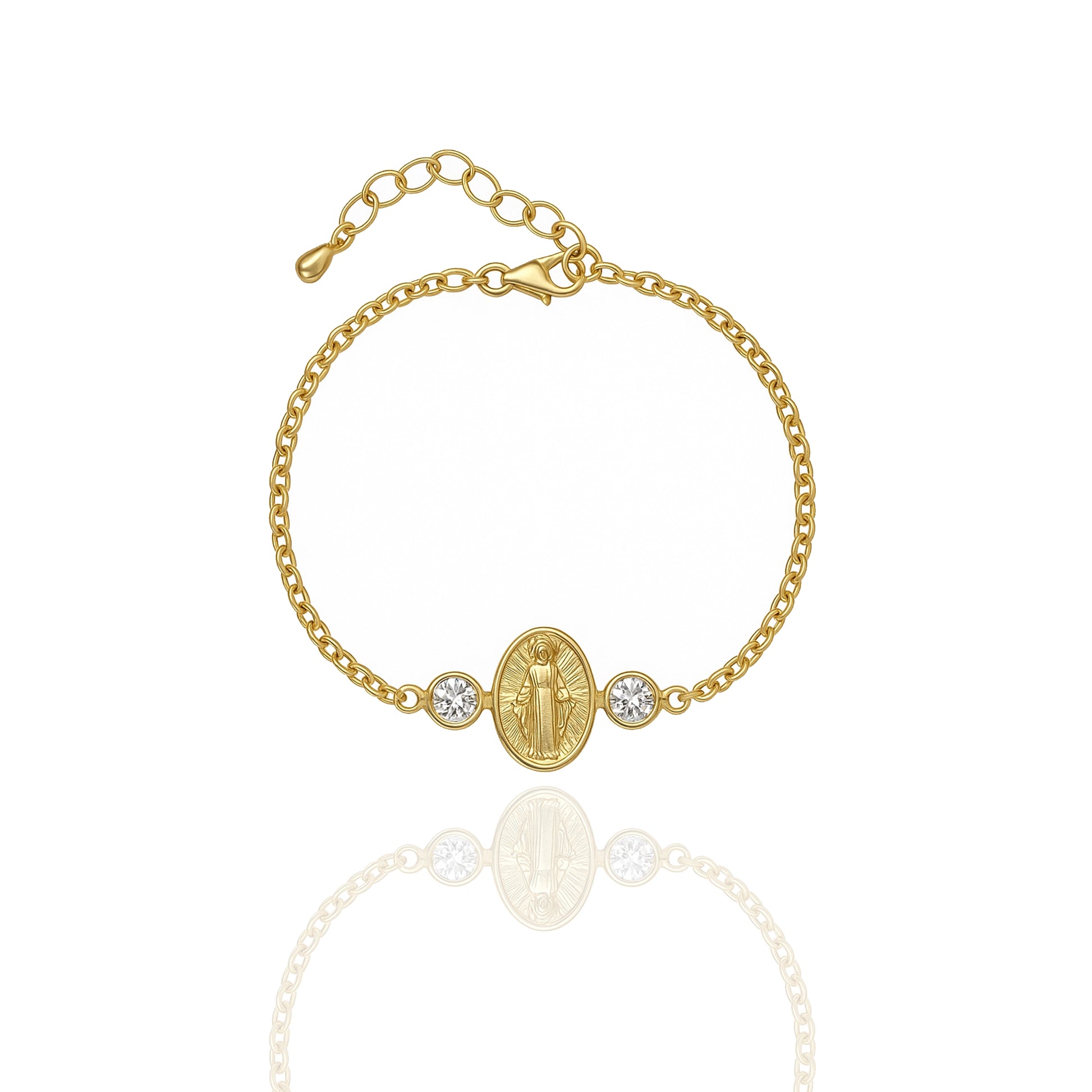 18K gold filled Virgin Mary bracelet with an oval Our Lady of Grace charm flanked by two bezel-set cubic zirconia accents, shown against a white background with a soft mirrored reflection.
