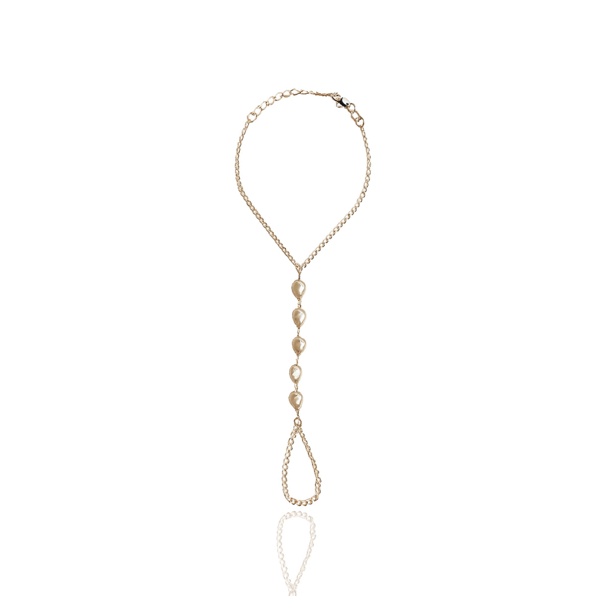 Pearl hand chain bracelet in 18K gold filled finish with baroque pearls and delicate finger bracelet design styled as bridal boho hand jewelry