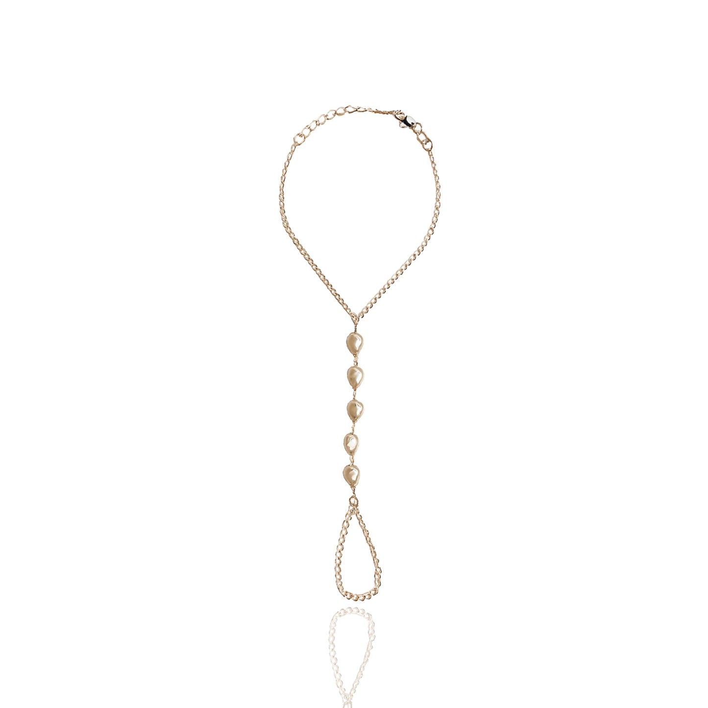 Elegant gold filled pearl hand chain bracelet with baroque-style imitation pearls, adjustable wrist clasp and delicate finger loop, displayed flat against a clean white background.