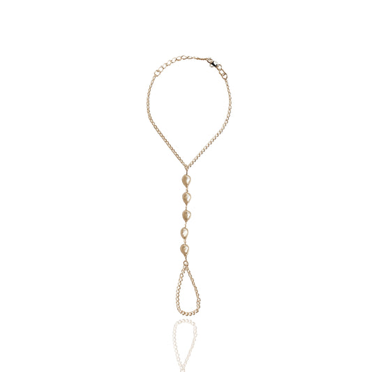 Elegant gold filled pearl hand chain bracelet with baroque-style imitation pearls, adjustable wrist clasp and delicate finger loop, displayed flat against a clean white background.
