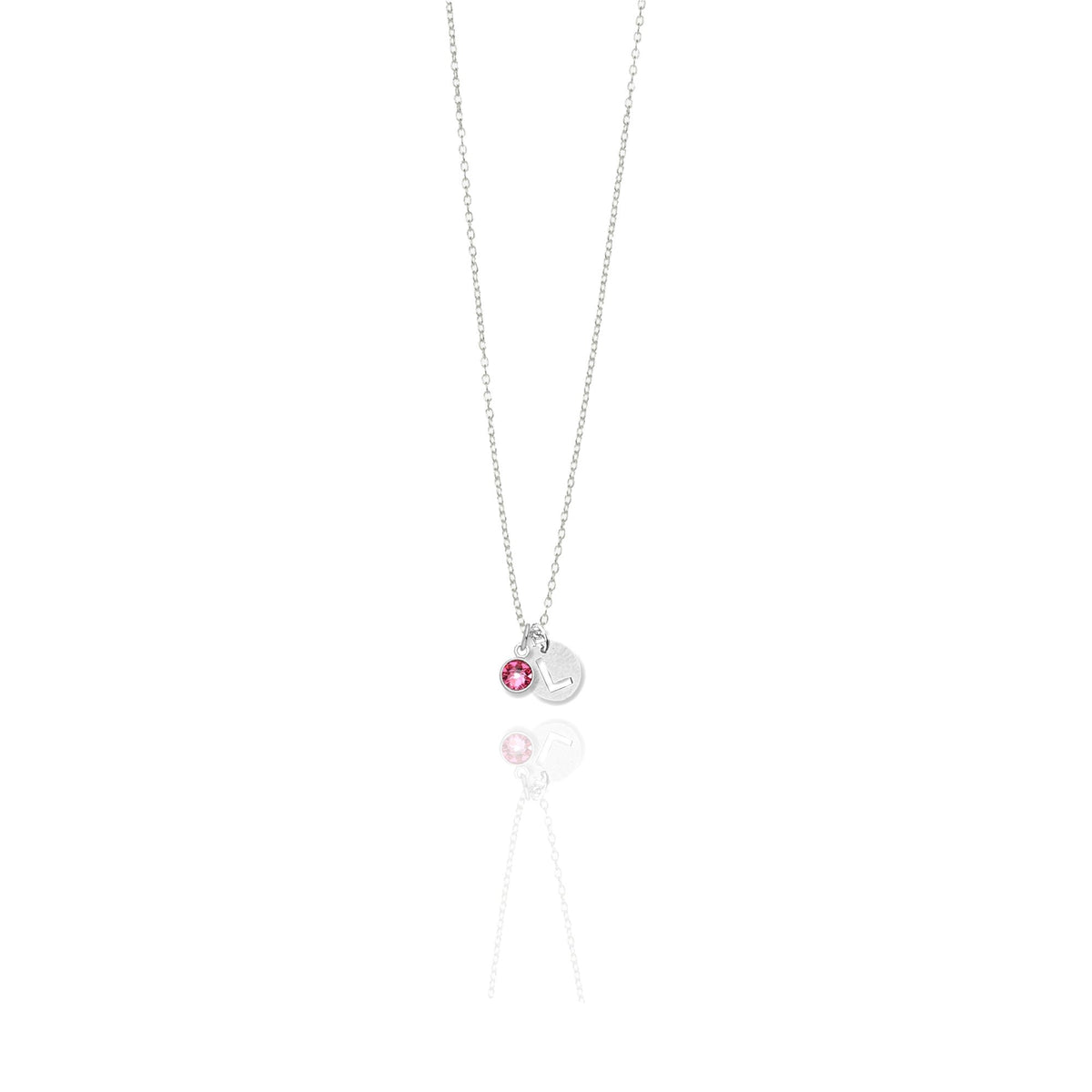 A sterling silver necklace featuring a round initial charm and a birthstone, suspended from a chain.