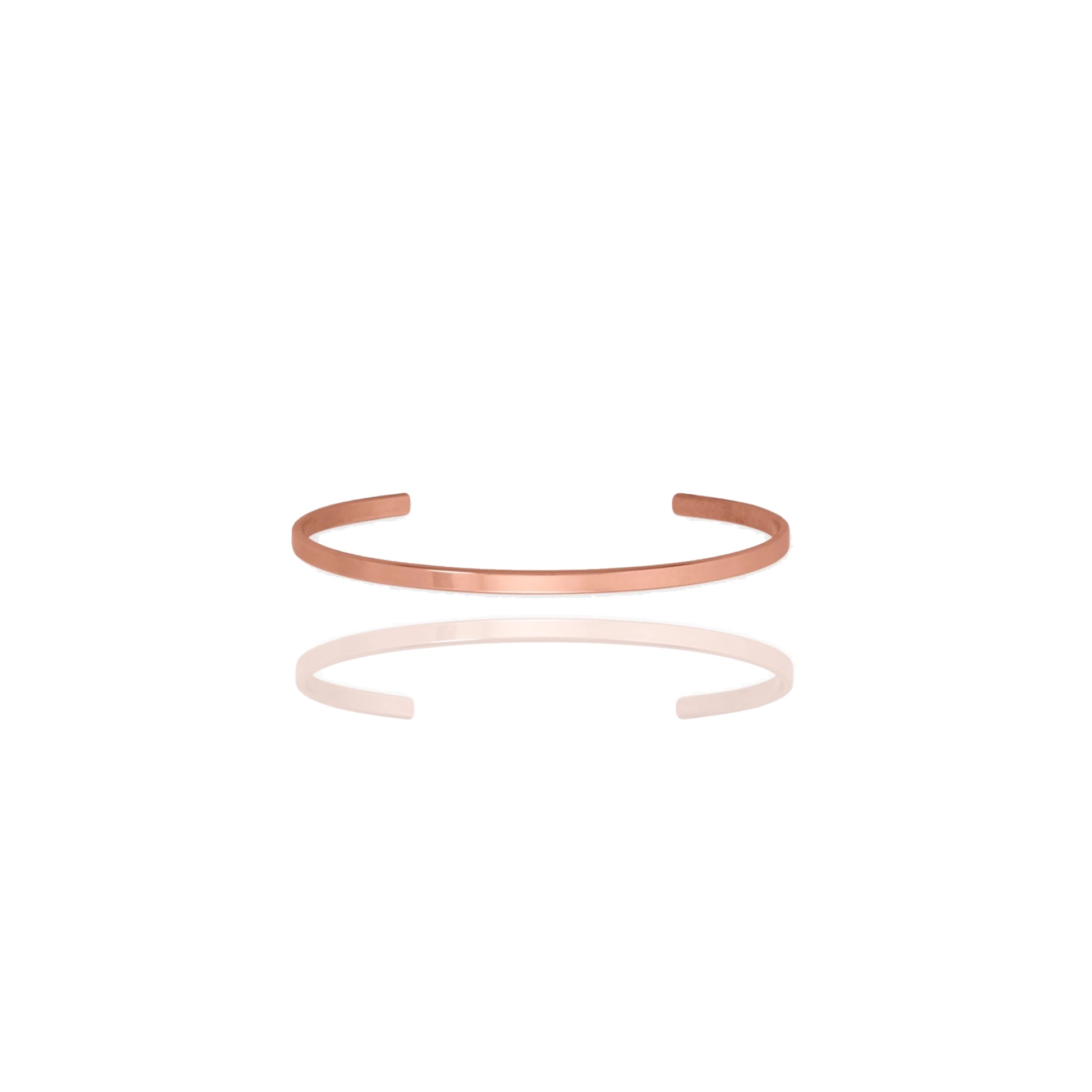 Tiny copper cuff bracelet on a white background