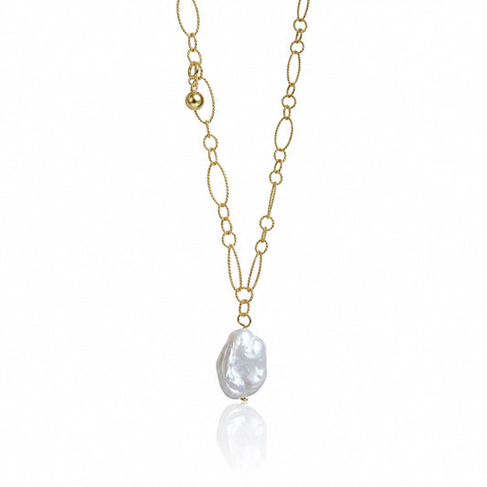A gold chain necklace featuring a large, irregular white baroque pearl pendant, displayed against a clean white background with a subtle reflection.