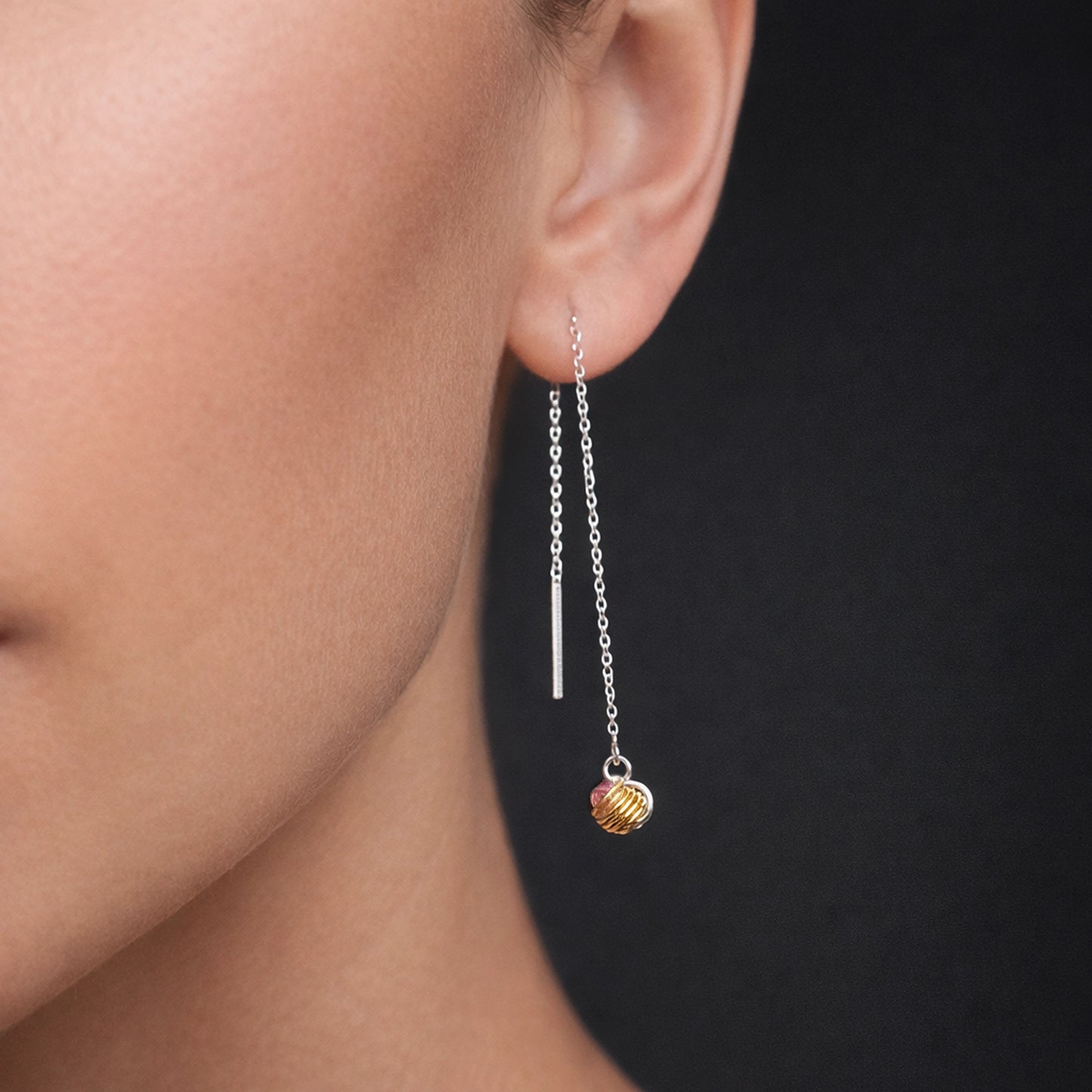 Dainty sterling silver threader earrings with delicate cable chain design, featuring minimalist bar drop and tri-color gold knot bead charm, asymmetrical lightweight dangle earrings shown in close-up studio lighting.