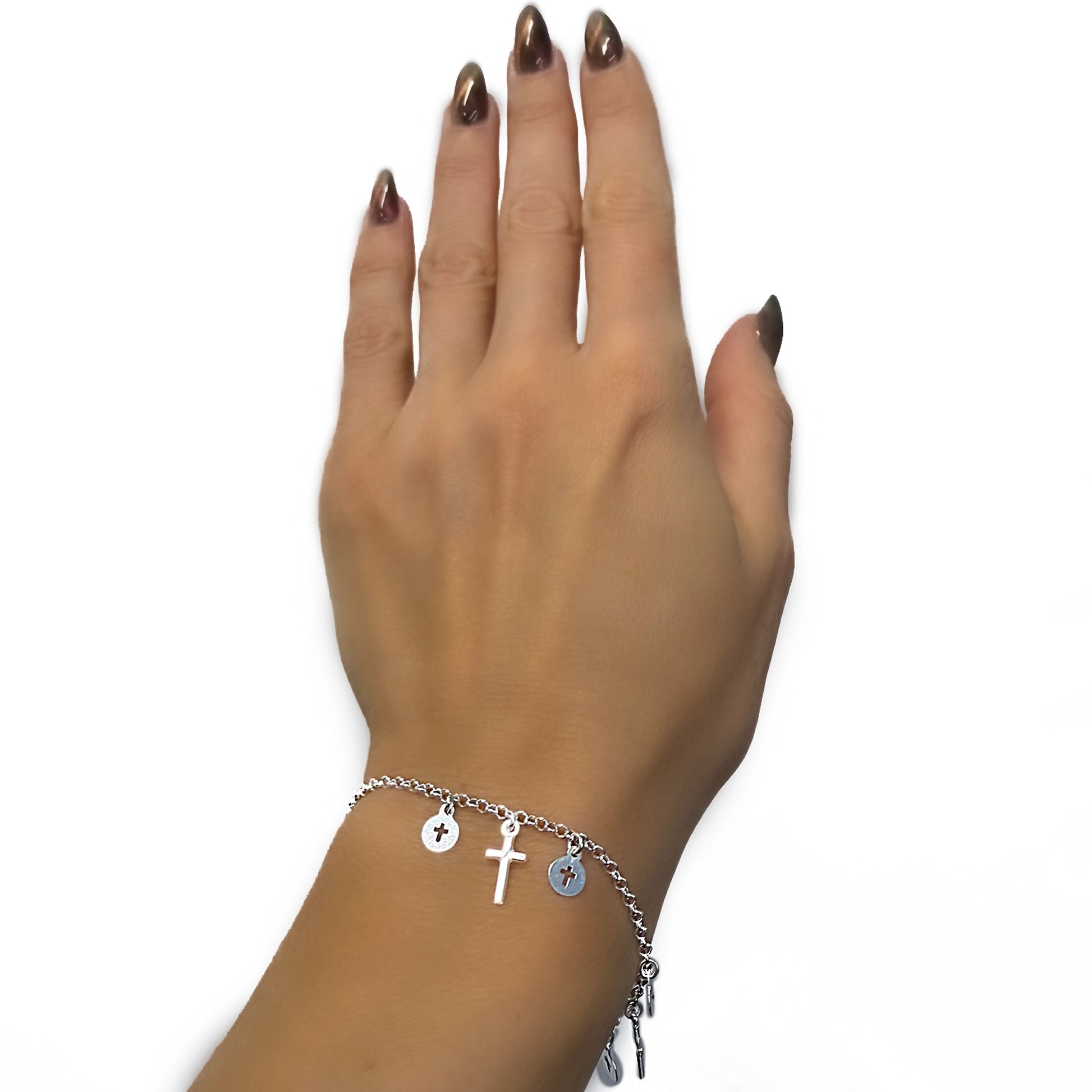 elegant sterling silver rosary bracelet with delicate cross charms displayed on a woman's hand, featuring minimalist discs and a tiny cross pendant for a dainty religious-inspired look