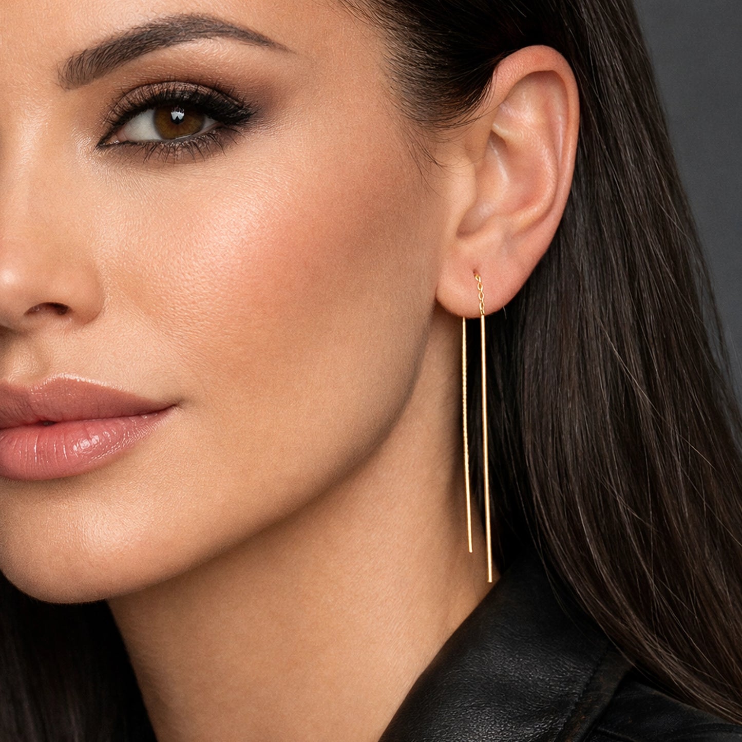 Elegantes pendientes de barra de oro con enhebrador