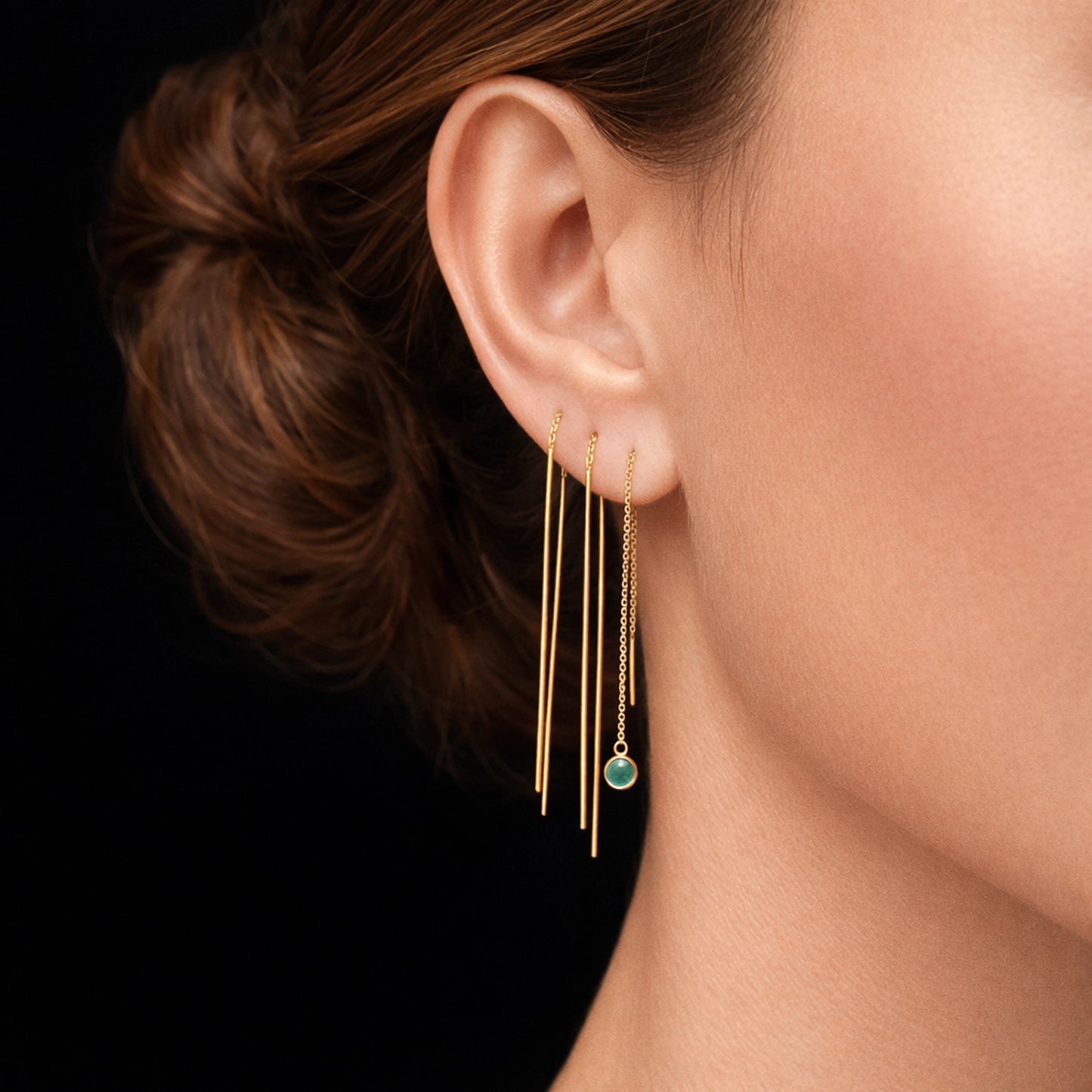 Elegantes pendientes de barra de oro con enhebrador