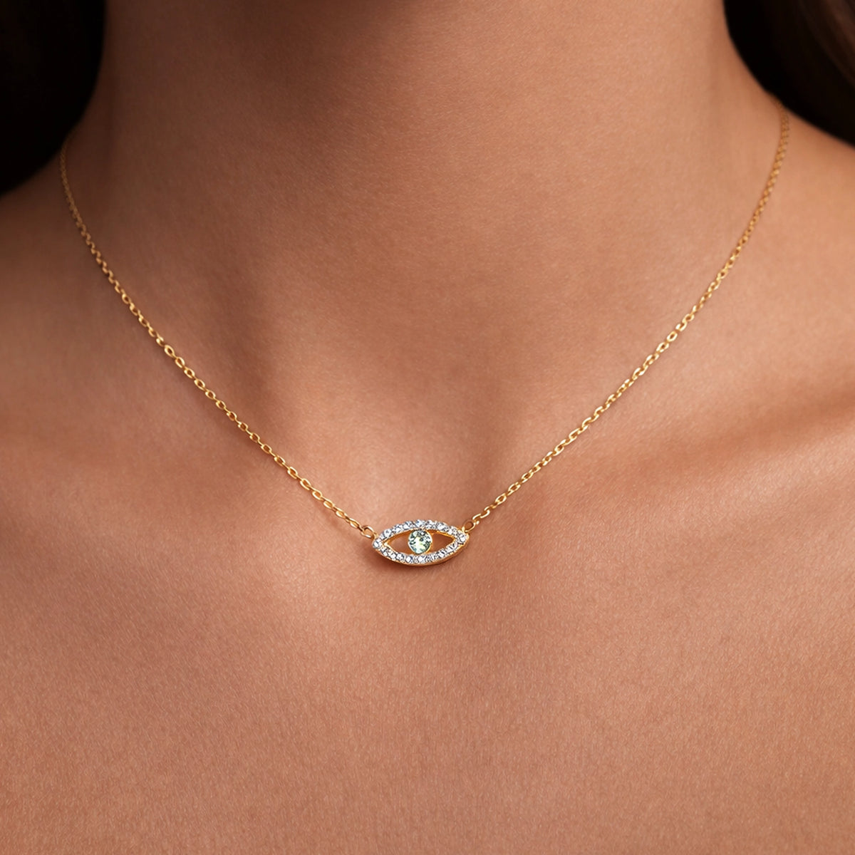 Gold plated sterling silver evil eye necklace with clear CZ stones and green center crystal on delicate cable chain, minimalist dainty protection charm jewelry gift for her.