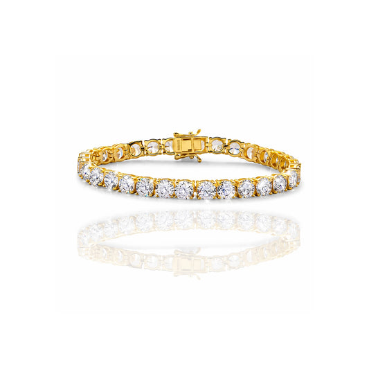 Gold tennis bracelet bracelet with cz diamonds on a white background