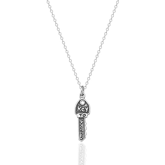 Minimalist sterling silver key to success necklace with oxidized 3D success charm on a dainty rhodium plated chain
