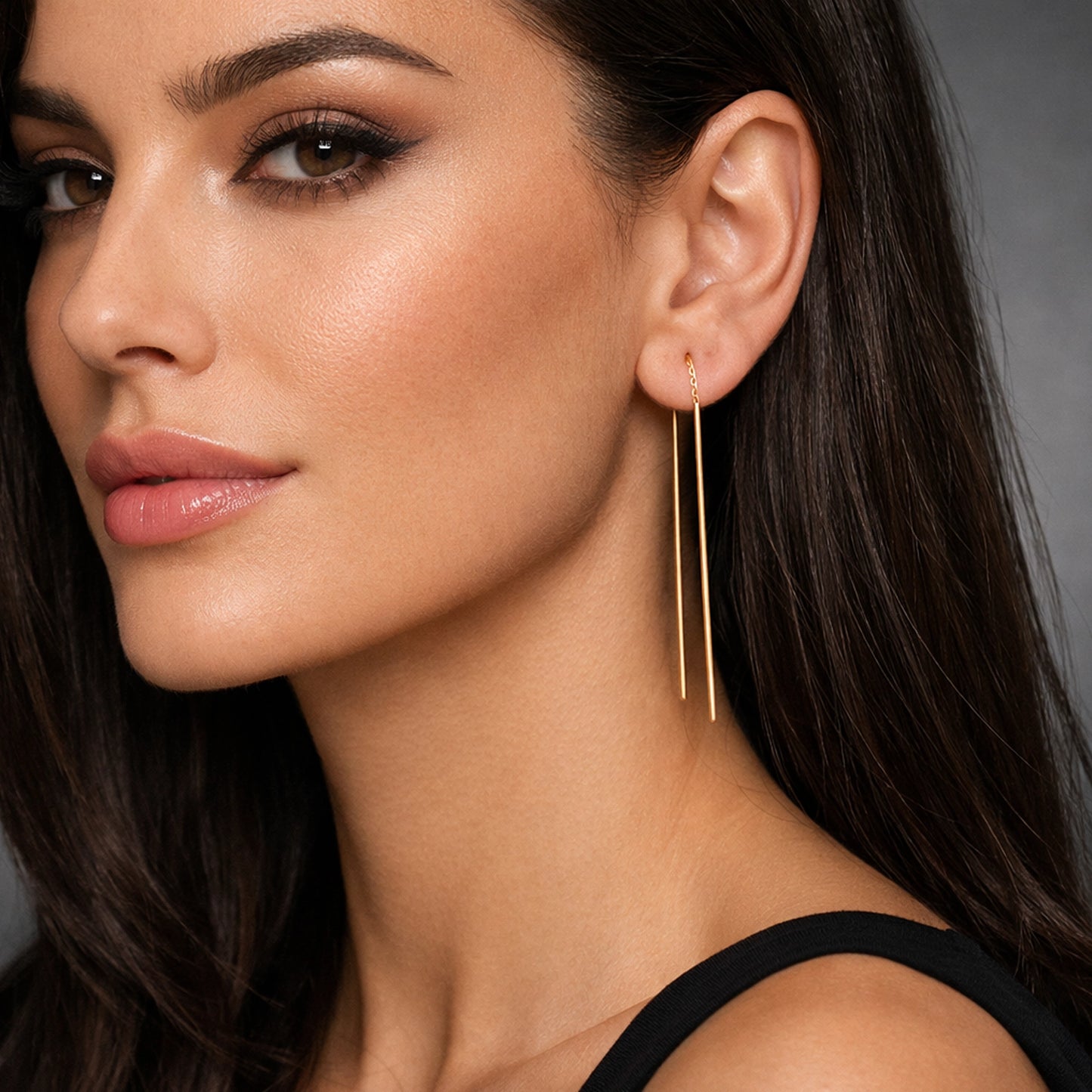 Elegantes pendientes de barra de oro con enhebrador