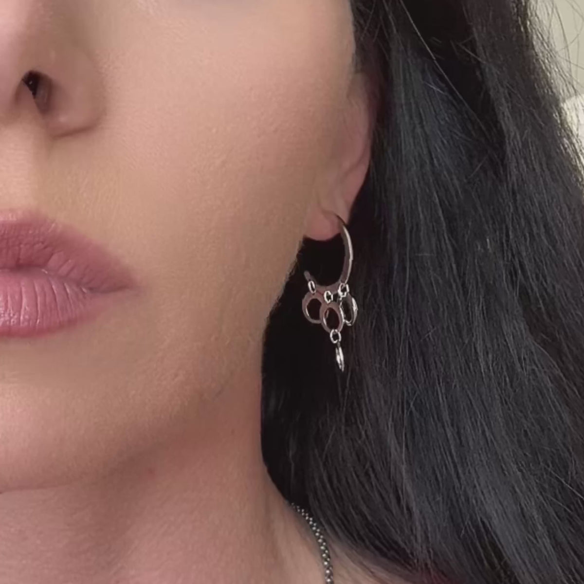 Video of a model showcasing bold sterling silver multi-hoop chandelier earring.