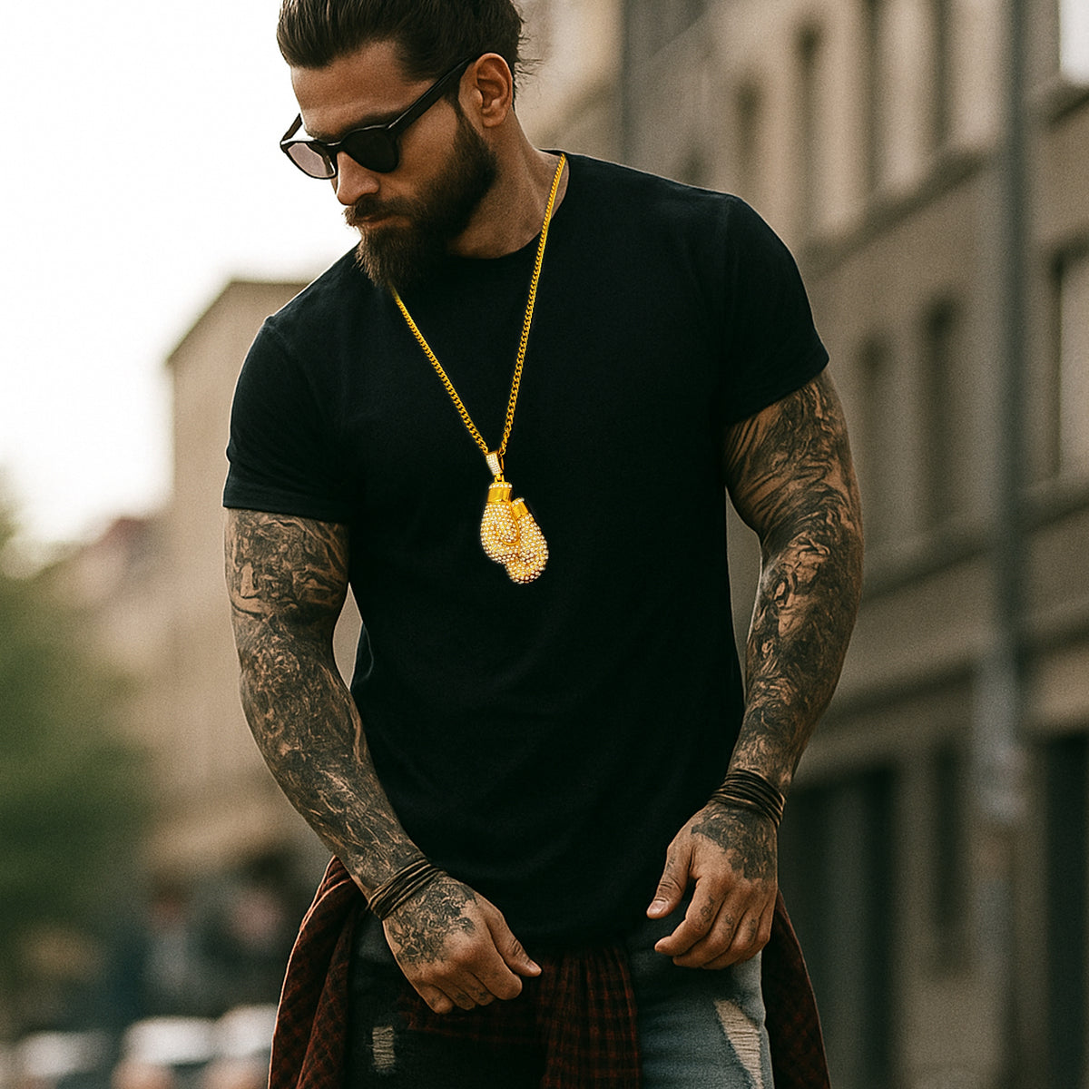 Stylish man with sunglasses wearing black shirt and CZ boxing glove necklace, streetwear hip hop vibe
