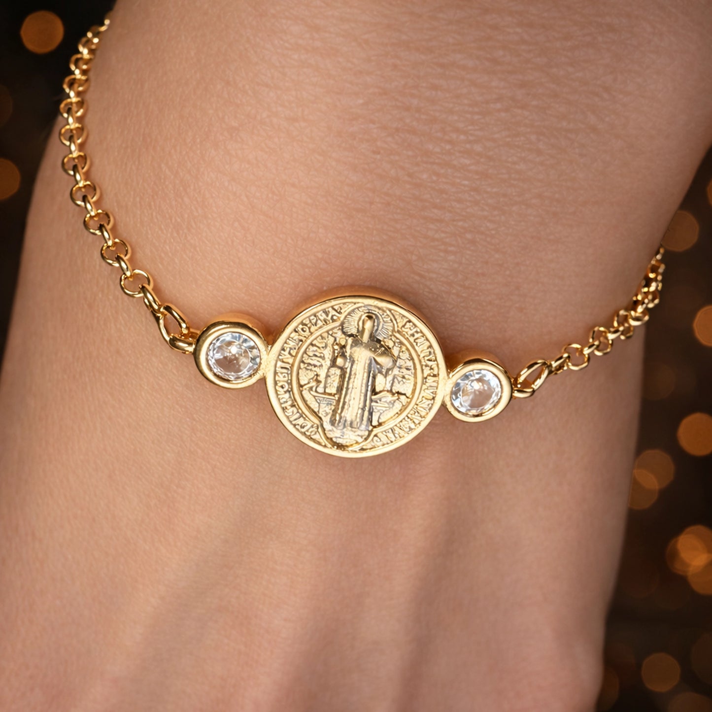 Saint Benedict gold filled medallion bracelet with bezel-set cubic zirconia stones on a delicate cable chain, worn on wrist, dainty Catholic jewelry, minimalist religious bracelet with crystal accents, everyday faith bracelet gift for women