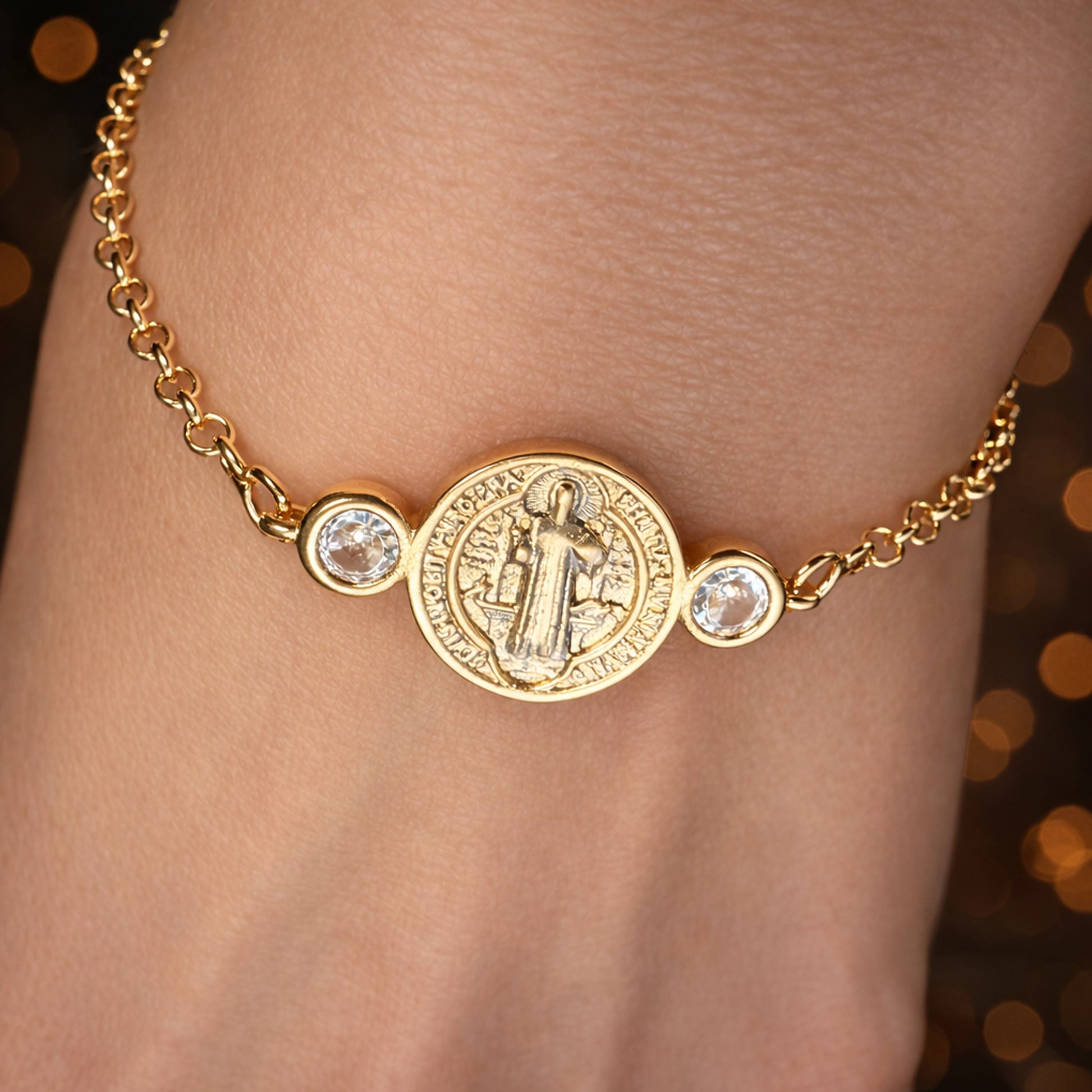Saint Benedict gold filled medallion bracelet with bezel-set cubic zirconia stones on a delicate cable chain, worn on wrist, dainty Catholic jewelry, minimalist religious bracelet with crystal accents, everyday faith bracelet gift for women