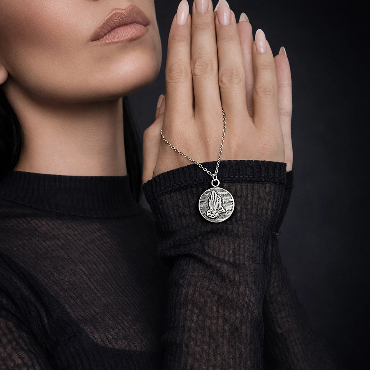 Praying Hands Medallion Necklace on Stylish Model • Sterling Silver Religious Pendant • Catholic Prayer Coin Necklace • Christian Faith Jewelry • Studio Portrait with Professional Lighting