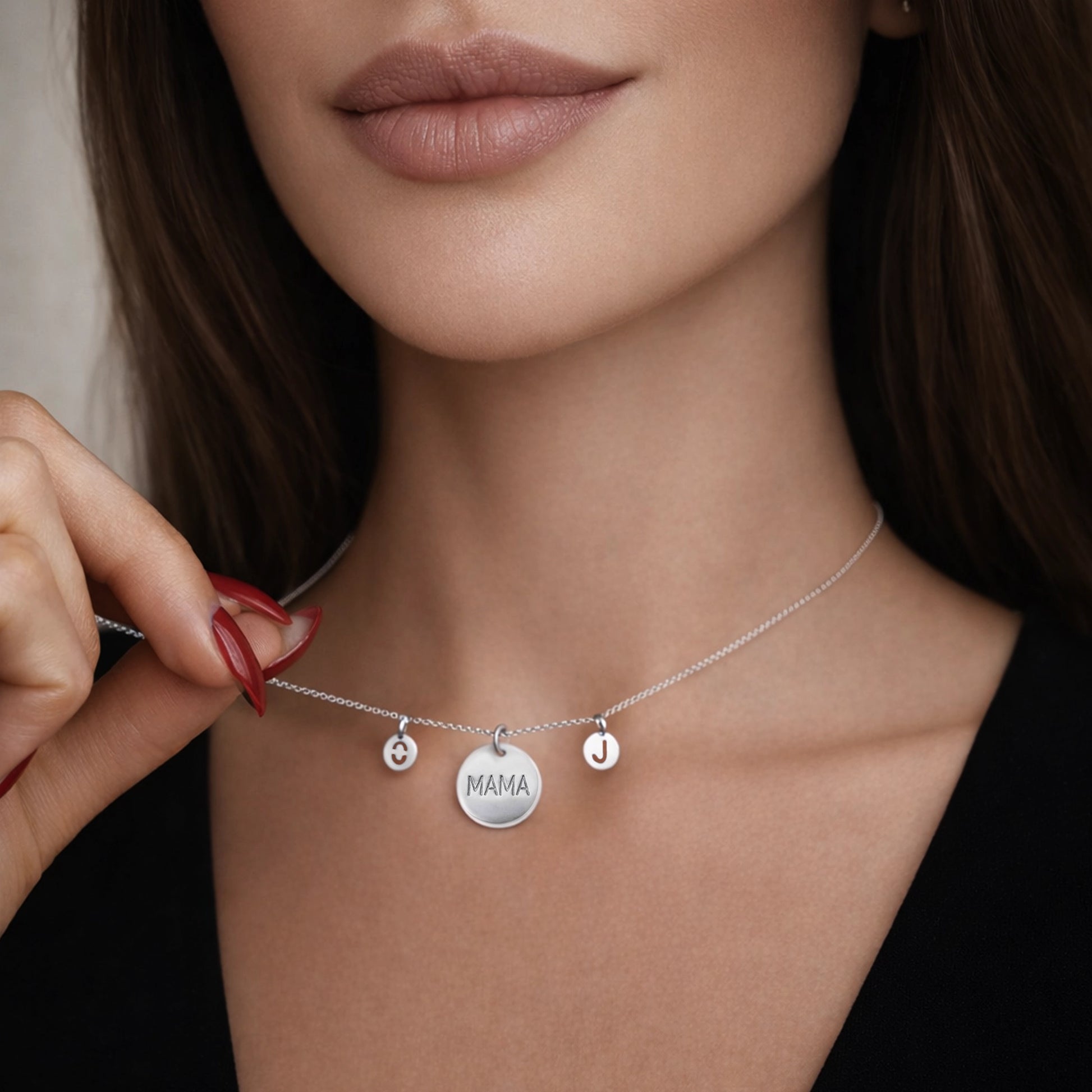 Silver personalized MAMA necklace with letter charms on a woman’s neck, delicate sterling silver chain, minimalist custom mother jewelry, elegant close-up
