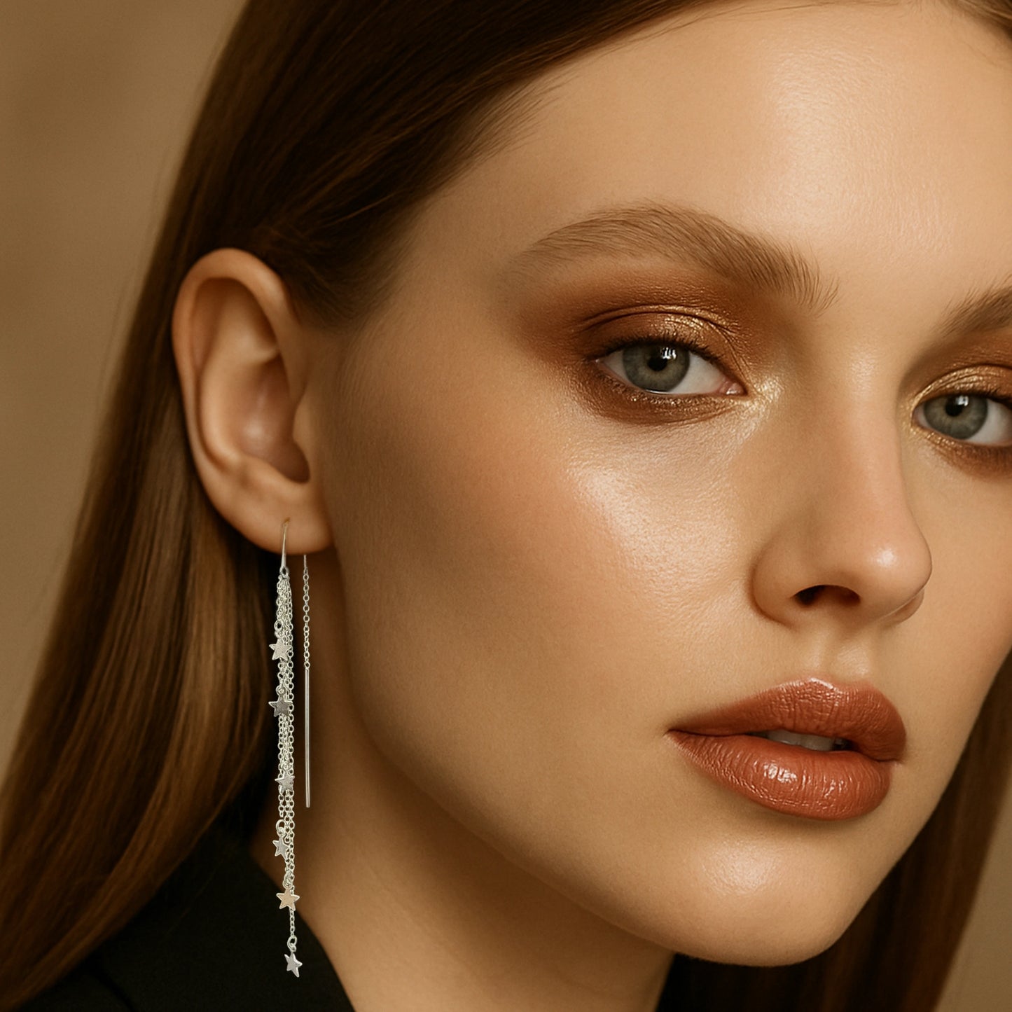 Model wearing sterling silver star threader earrings with long dangle chain.