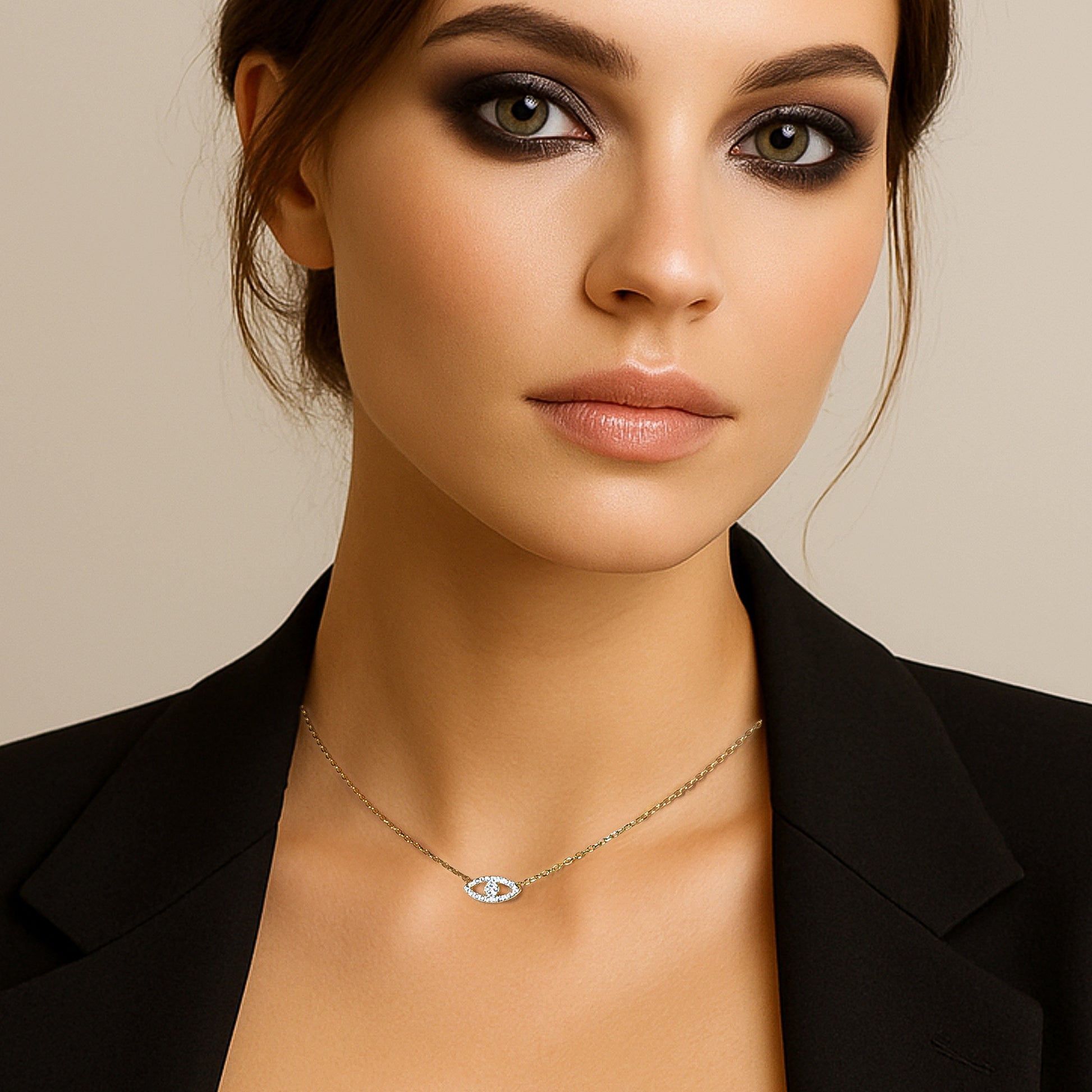 Stylish evil eye tiny gold adjustable necklace on a model wearing a black blazer, showcasing the elegant and minimalist design of the pendant.