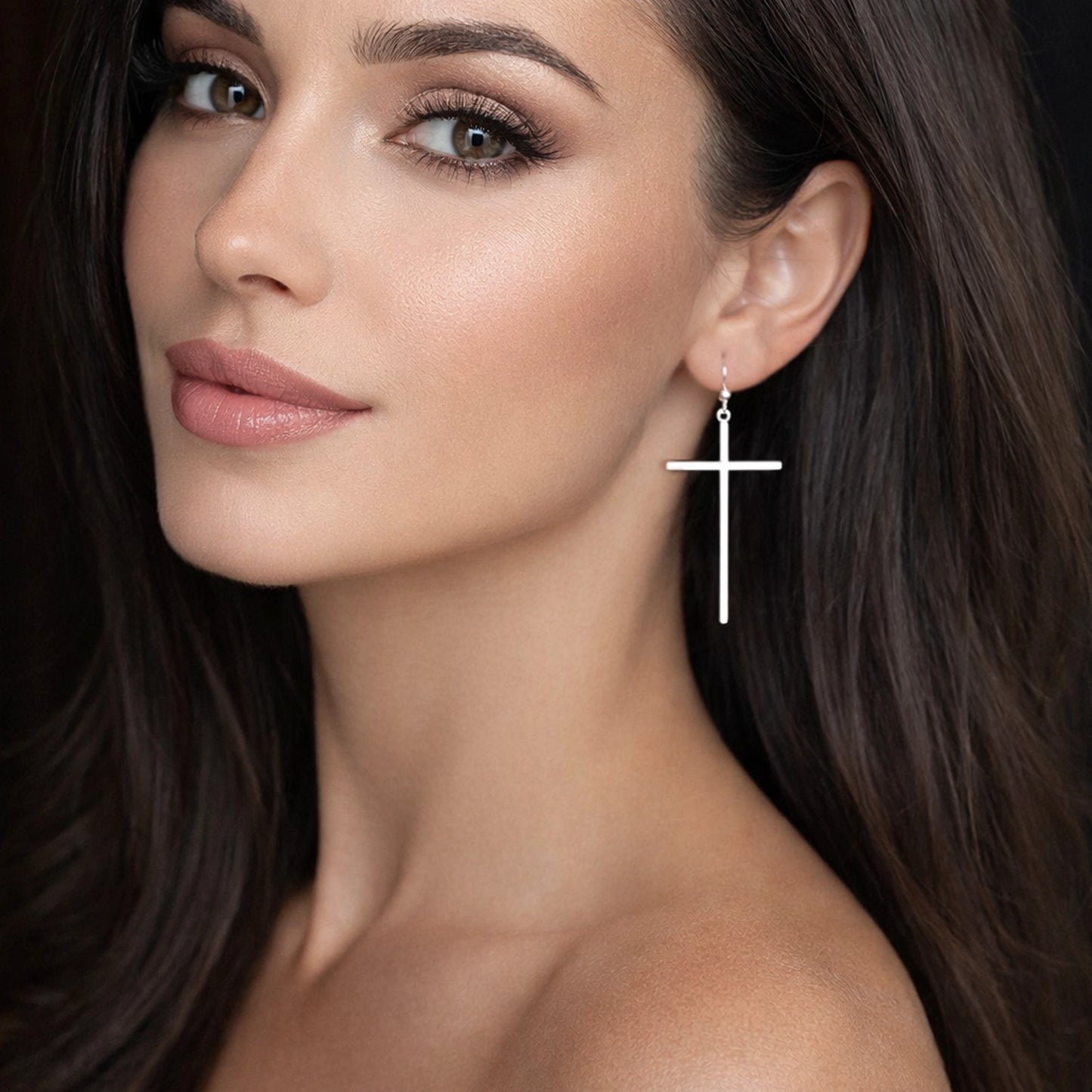 Stylish plain cross dangle earrings for women, modern minimalist Christian earrings shown on model close-up